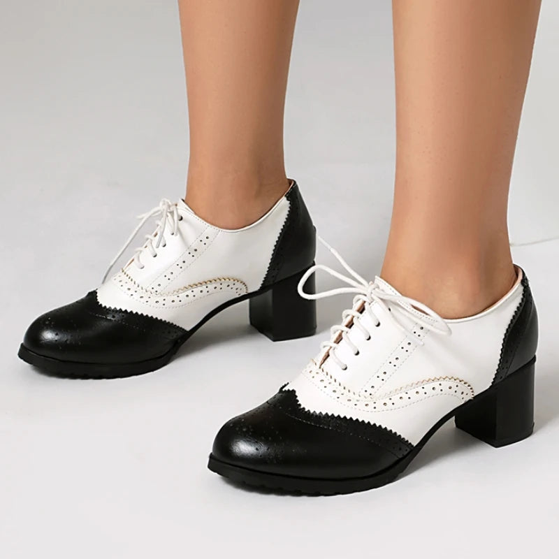 women's-black-and-white-heeled-oxfords-wearing